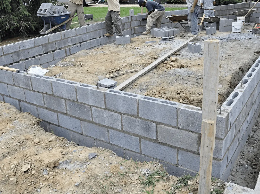 Professionals building a foundation with blocks in Bellevue, WA